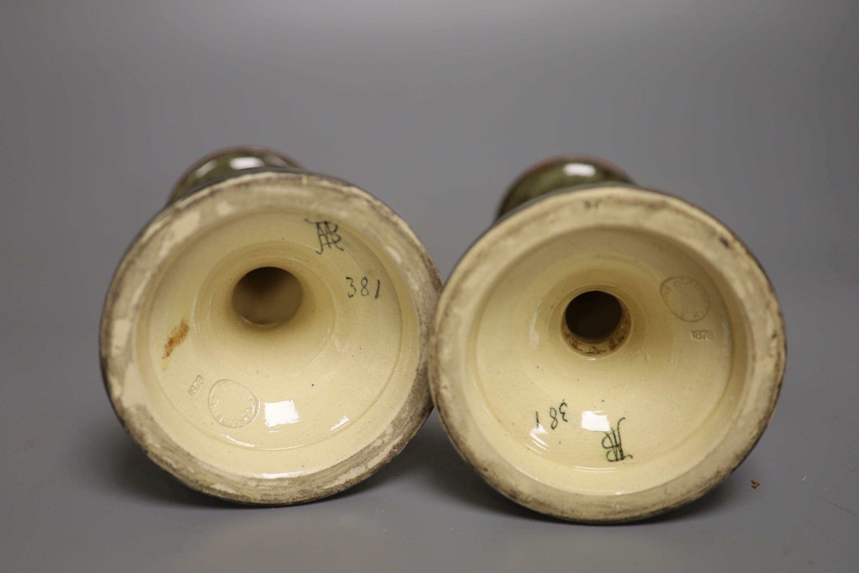 A pair of Doulton Lambeth candlesticks, decorated by Mary Butterton, height 20cm
